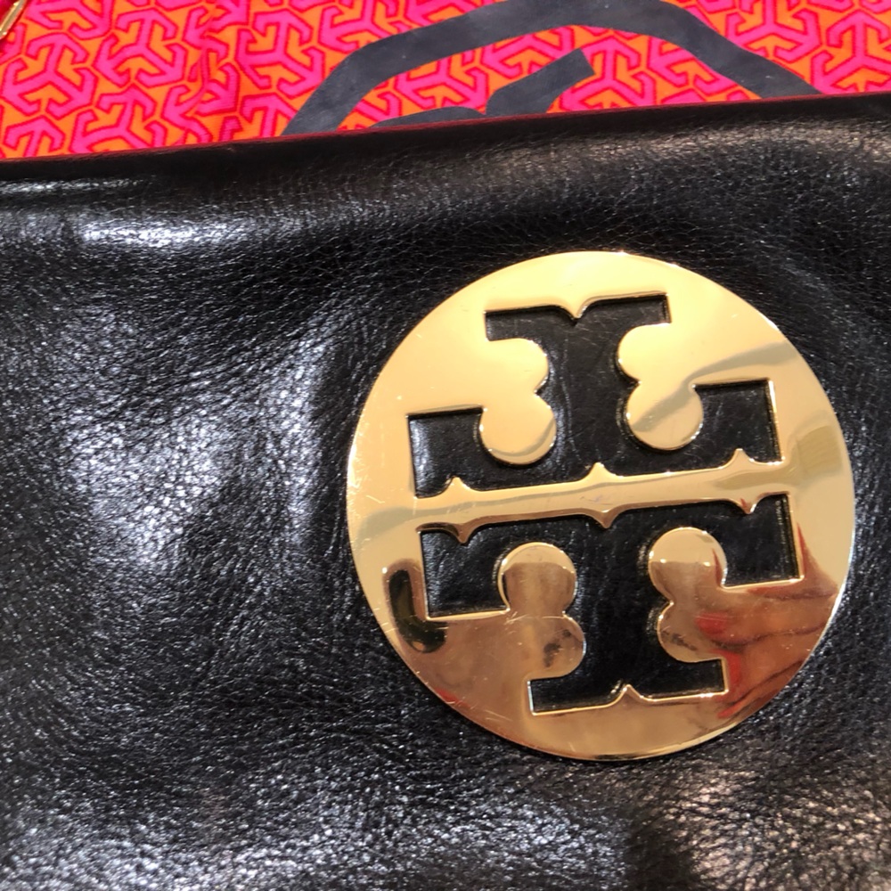 Tory Burch clutch with good accents. Comes with duster bag. Great condition